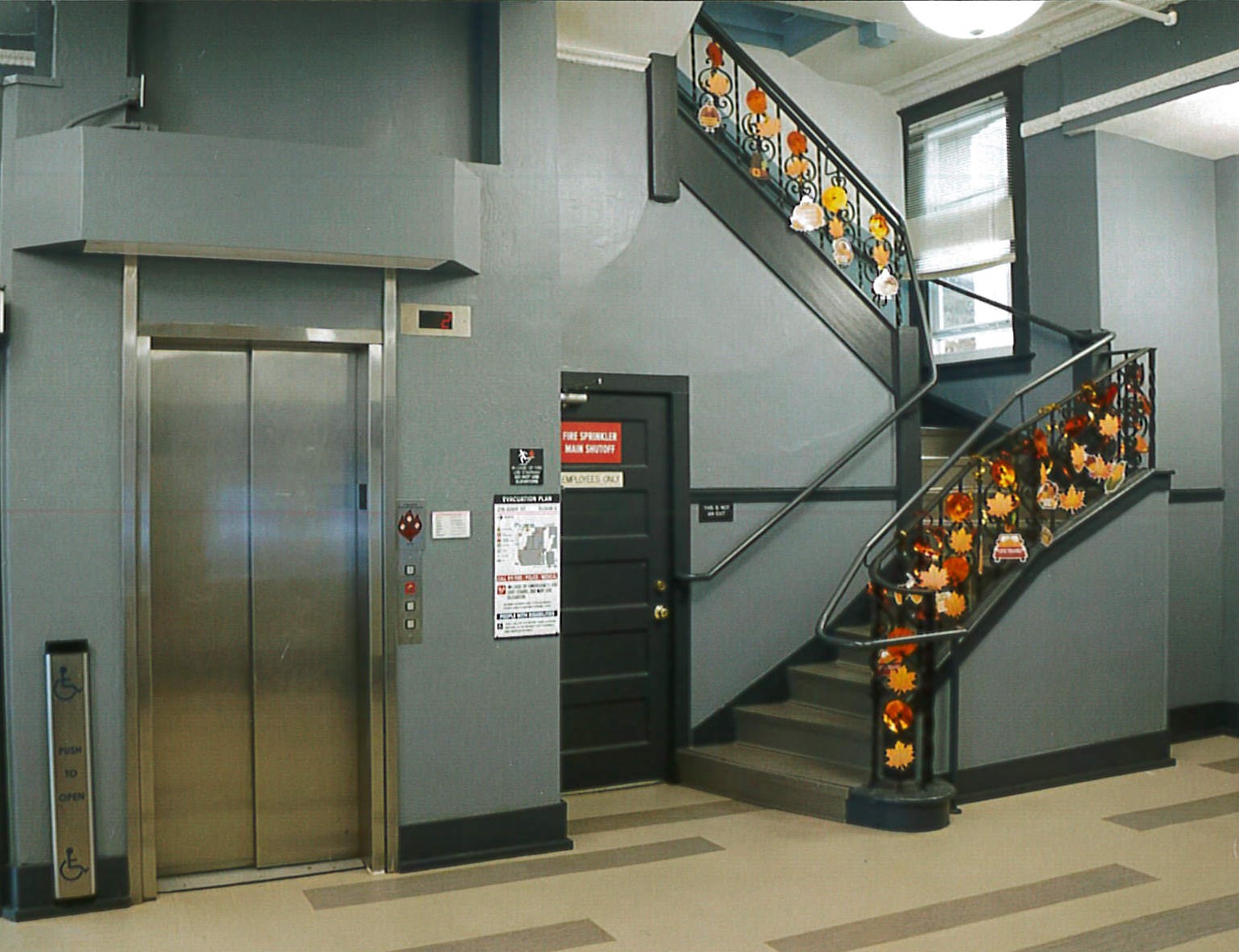Restored lobby stairs, elevator 